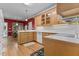 Charming kitchen with wooden cabinets, white countertops, and a view to the dining area at 104 Crossway Ln, Holly Springs, NC 27540