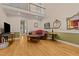 Inviting living room featuring hardwood floors, high ceilings, and an upstairs balcony view at 104 Crossway Ln, Holly Springs, NC 27540
