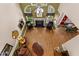 Vaulted living room with hardwood floors, fireplace, and cozy seating, perfect for Gathering gatherings at 104 Crossway Ln, Holly Springs, NC 27540