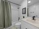Cozy bathroom featuring a shower and tub, vanity, and a toilet at 104 Pontiac Cv, Louisburg, NC 27549