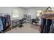 Functional bedroom with desk, chairs, and natural light from the windows at 104 Pontiac Cv, Louisburg, NC 27549