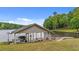 Covered boat dock on the water with a boat lift, seating and plenty of dock space at 104 Pontiac Cv, Louisburg, NC 27549