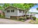 Well-maintained home featuring horizontal siding, large deck, and landscaped yard at 104 Pontiac Cv, Louisburg, NC 27549