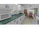 Bright kitchen featuring modern appliances and an adjacent dining area at 104 Pontiac Cv, Louisburg, NC 27549