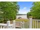 A serene view from the deck, showcasing the lake and a private boat dock at 104 Pontiac Cv, Louisburg, NC 27549