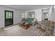 Cozy living room with neutral carpet, and a front door view at 104 Pontiac Cv, Louisburg, NC 27549