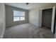 Bedroom with carpet flooring, a large window, and a closet at 105 Blue Bay Ln, Cameron, NC 28326