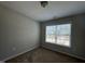 Carpeted bedroom with natural light streaming in from a large window at 105 Blue Bay Ln, Cameron, NC 28326