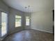 Bright dining room with tile flooring, a chandelier, and access to the backyard at 105 Blue Bay Ln, Cameron, NC 28326
