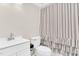 Clean bathroom featuring a modern vanity and classic striped shower curtain at 105 N 11Th St, Erwin, NC 28339