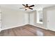 Bright bedroom with hardwood floors, neutral paint, ample natural light, and ceiling fan at 105 N 11Th St, Erwin, NC 28339