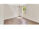 Bright bedroom with hardwood flooring, chandelier lighting, and natural light at 105 N 11Th St, Erwin, NC 28339