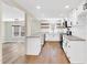 Modern kitchen with sleek countertops, white cabinets, stainless steel appliances, and an open layout at 105 N 11Th St, Erwin, NC 28339