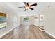Bright living room features hardwood floors, ceiling fan and natural light at 105 N 11Th St, Erwin, NC 28339