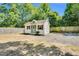 White shed featuring a door with side lites and gray trim at 105 N 11Th St, Erwin, NC 28339