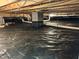 Encapsulated crawl space showing a clean moisture barrier and properly supported floor joists at 110 Pebble Creek Dr, Franklinton, NC 27525