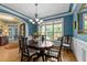 Bright dining area featuring a round table, chandelier, large window, and colorful decor, perfect for Gathering gatherings at 110 Pebble Creek Dr, Franklinton, NC 27525