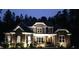 Beautifully lit home at night with stone accents, offering inviting curb appeal at 110 Pebble Creek Dr, Franklinton, NC 27525
