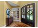 Grand foyer showcasing hardwood floors, stained glass door, and stylish decor at 110 Pebble Creek Dr, Franklinton, NC 27525