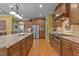 Spacious open kitchen with a large island, stainless appliances, and wood flooring at 110 Pebble Creek Dr, Franklinton, NC 27525