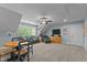 Spacious bonus room provides ample space for seating and a game table, perfect for entertainment at 110 Pebble Creek Dr, Franklinton, NC 27525