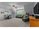 Spacious bonus room provides ample space for seating and a game table, perfect for entertainment at 110 Pebble Creek Dr, Franklinton, NC 27525