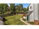 Lush backyard offers a private retreat with mature trees and a wooden fence at 1114 Balmoral Dr, Cary, NC 27511