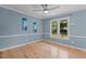 Bright bedroom with a ceiling fan, hardwood floors, and neutral paint at 1114 Balmoral Dr, Cary, NC 27511