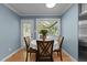 Dining area with access to the screened porch has a table with seating for four at 1114 Balmoral Dr, Cary, NC 27511