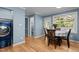 Bright dining area features wood floors and access to a sunroom or enclosed porch at 1114 Balmoral Dr, Cary, NC 27511