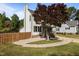 Landscaped yard and manicured lawn surround this charming home with green shutters at 1114 Balmoral Dr, Cary, NC 27511