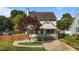 Charming two-story home boasts a welcoming front porch and well-manicured lawn at 1114 Balmoral Dr, Cary, NC 27511