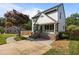 Charming two-story home boasts a welcoming front porch and well-manicured lawn at 1114 Balmoral Dr, Cary, NC 27511