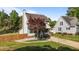 Charming two-story home boasts a welcoming front porch and well-manicured lawn at 1114 Balmoral Dr, Cary, NC 27511
