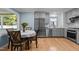 Modern kitchen with gray cabinetry, stainless steel appliances, and hardwood floors at 1114 Balmoral Dr, Cary, NC 27511