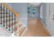 Bright living room boasts hardwood floors, a ceiling fan and plenty of natural light at 1114 Balmoral Dr, Cary, NC 27511