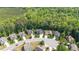 Aerial view of the homes in the neighborhood surrounded by lush trees at 114 Bell Tower Ct, Elon, NC 27244