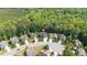 Aerial view of home with location pin in a wooded neighborhood at 114 Bell Tower Ct, Elon, NC 27244