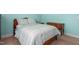 Bedroom with light blue walls, wooden furniture, carpet and comfortable bed at 114 Bell Tower Ct, Elon, NC 27244