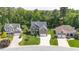 Charming exterior view highlighting the manicured lawn, brick accents, and inviting curb appeal of this suburban home at 114 Bell Tower Ct, Elon, NC 27244