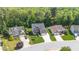 Charming exterior view highlighting the manicured lawn, brick accents, and inviting curb appeal of this suburban home at 114 Bell Tower Ct, Elon, NC 27244