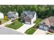 Beautiful two-story home featuring brick accents, a well-manicured lawn, and a spacious driveway with a two-car garage at 114 Bell Tower Ct, Elon, NC 27244