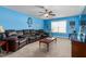 Large living room with expansive couch, window view, and carpeted floors at 114 Bell Tower Ct, Elon, NC 27244