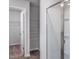 Bathroom view featuring a glass enclosed shower, closet, and tile flooring at 11412 International Dr, Middlesex, NC 27557