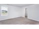Well-lit bedroom with neutral carpet, window, and closet at 11412 International Dr, Middlesex, NC 27557