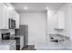 Well-equipped kitchen with stainless steel appliances, granite countertops, and ample storage space at 11412 International Dr, Middlesex, NC 27557