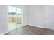 Bright space with luxury vinyl flooring and sliding glass doors leading to outdoor deck at 11412 International Dr, Middlesex, NC 27557