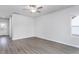 Bright, open living space with luxury vinyl flooring and an adjacent doorway to other parts of the home at 11412 International Dr, Middlesex, NC 27557