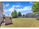 Large, grassy backyard with a shed, mature trees, and full fence line at 120 Cobblebrook Ct, Holly Springs, NC 27540