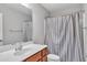 Bathroom featuring wood vanity and shower with curtain at 120 Cobblebrook Ct, Holly Springs, NC 27540
